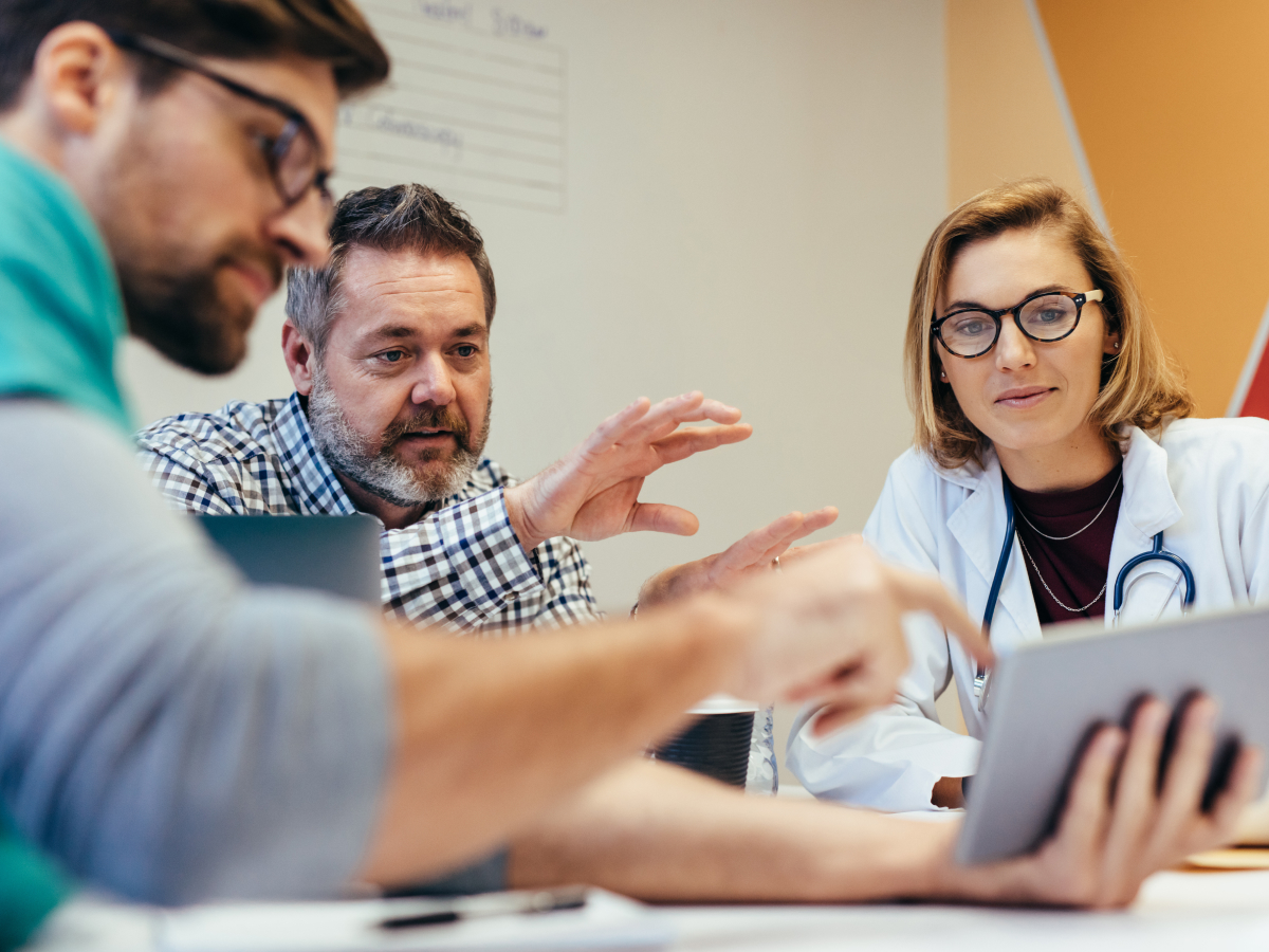 A group of health professionals and marketing specialists collaborating on an AI-driven health platform