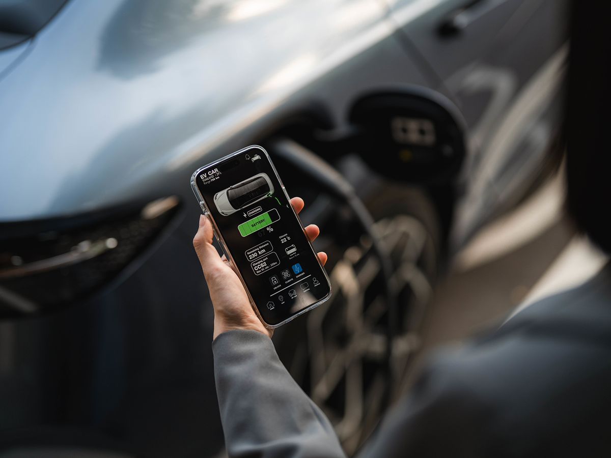 A sleek electric vehicle charging at a futuristic station, showcasing the evolution of sustainable transportation.  