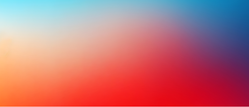 A soft, blurred mix of red, blue, and white hues in the background