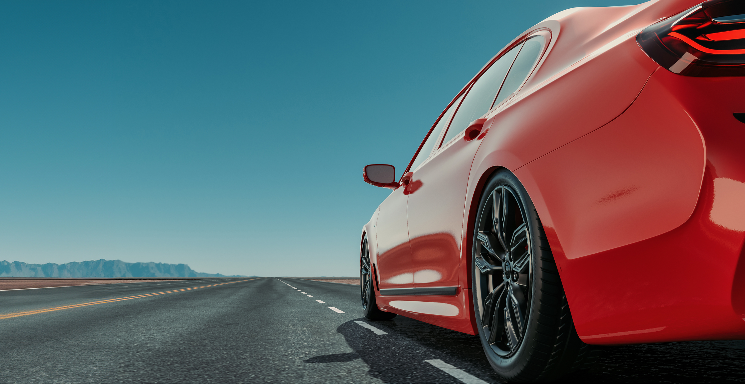 Close-up of a red sports car driving on an open highway under a clear blue sky, representing modern mobility and streamlined digital car experiences.