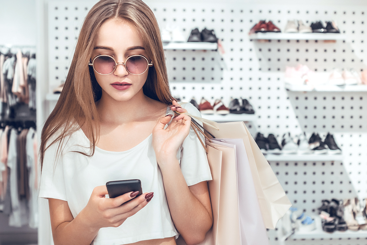 Woman on her phone in retail store