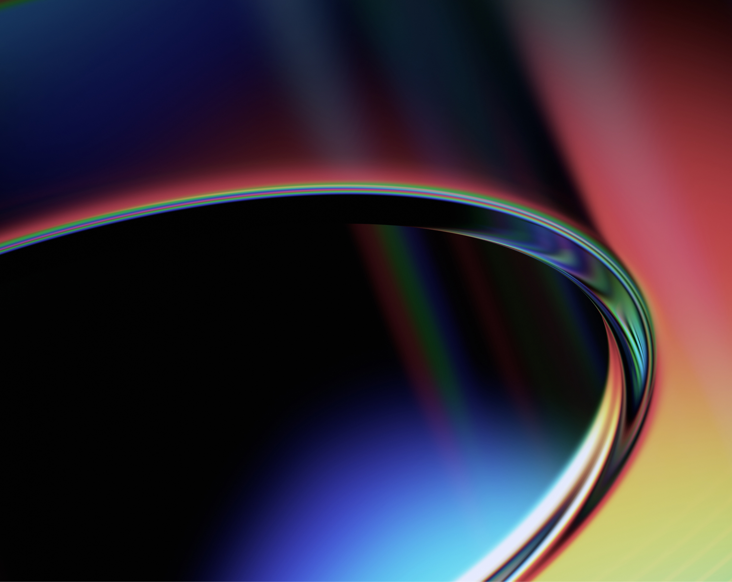An abstract image featuring smooth, curved shapes with a gradient of vibrant colors including blue, red, and yellow, creating a sleek and dynamic visual effect.