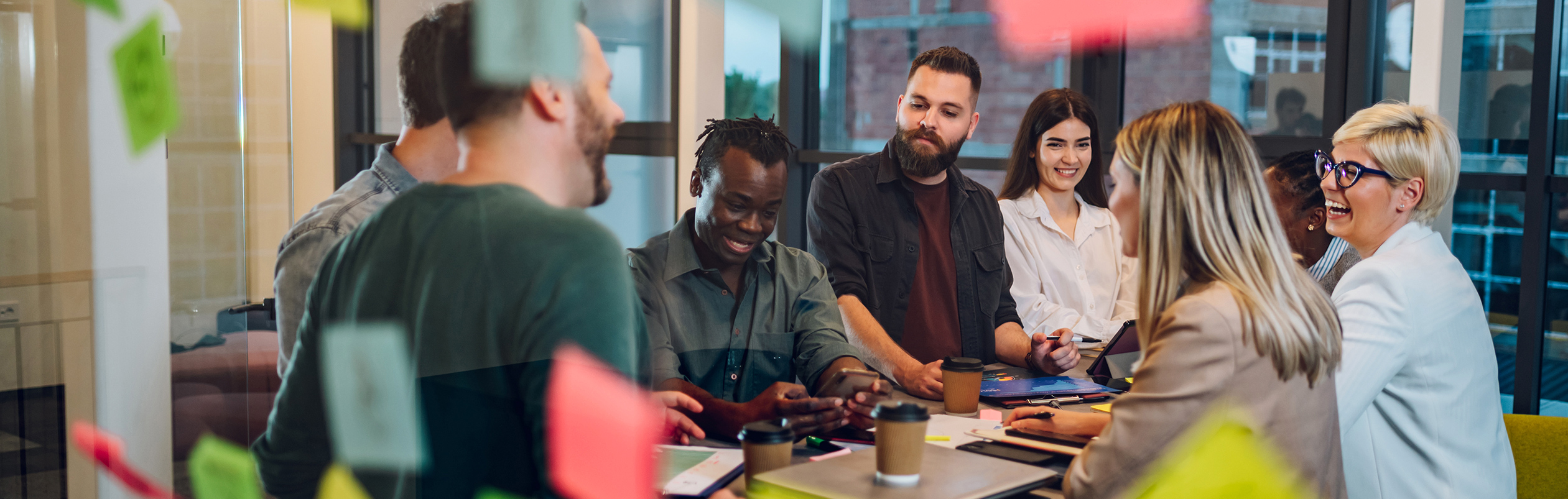 Colleagues collaborate in the office on a project related to Valtech Inside