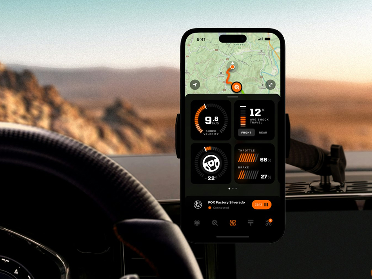 A smartphone displaying a colorful dashboard app with various metrics and graphs on the screen