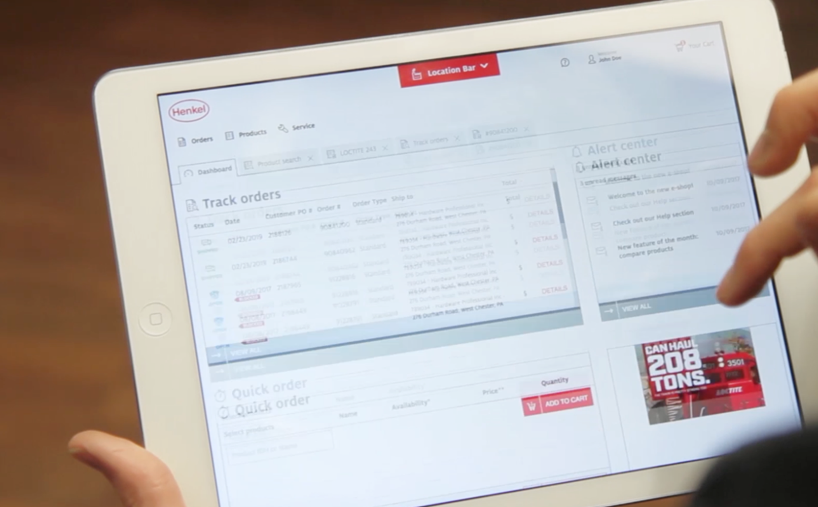 Holding a tablet with B2B platform