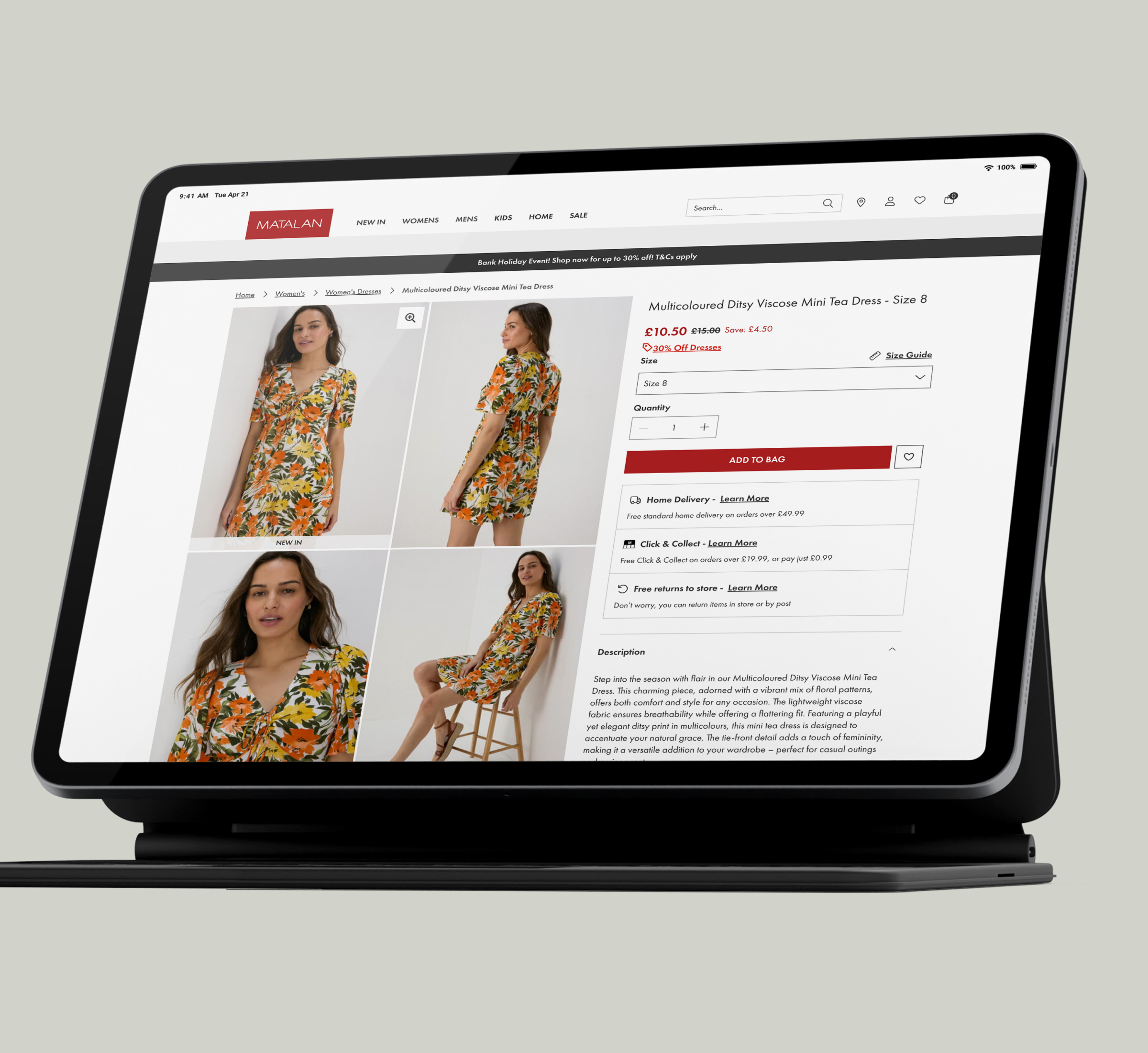 A tablet screen displaying the Matalan website product page for a multicolored ditsy viscose mini tea dress. The page shows multiple images of a model wearing the floral dress, with details on pricing, size options, and delivery methods. The screen is in landscape mode, providing a clear view of the shopping interface.