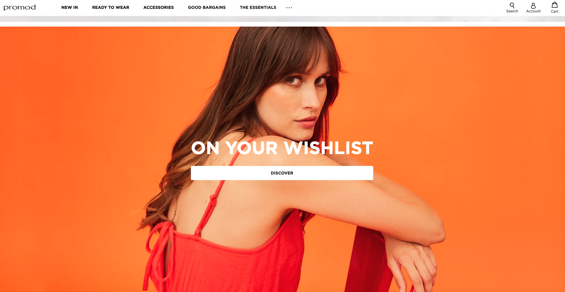 Orange background with woman sitting in centre smiling at camera