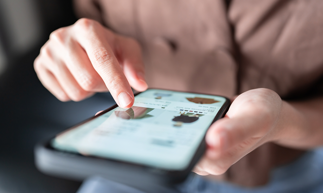 Close-up of a person browsing an online retail store on a smartphone, highlighting mobile commerce and AI-powered product recommendations.