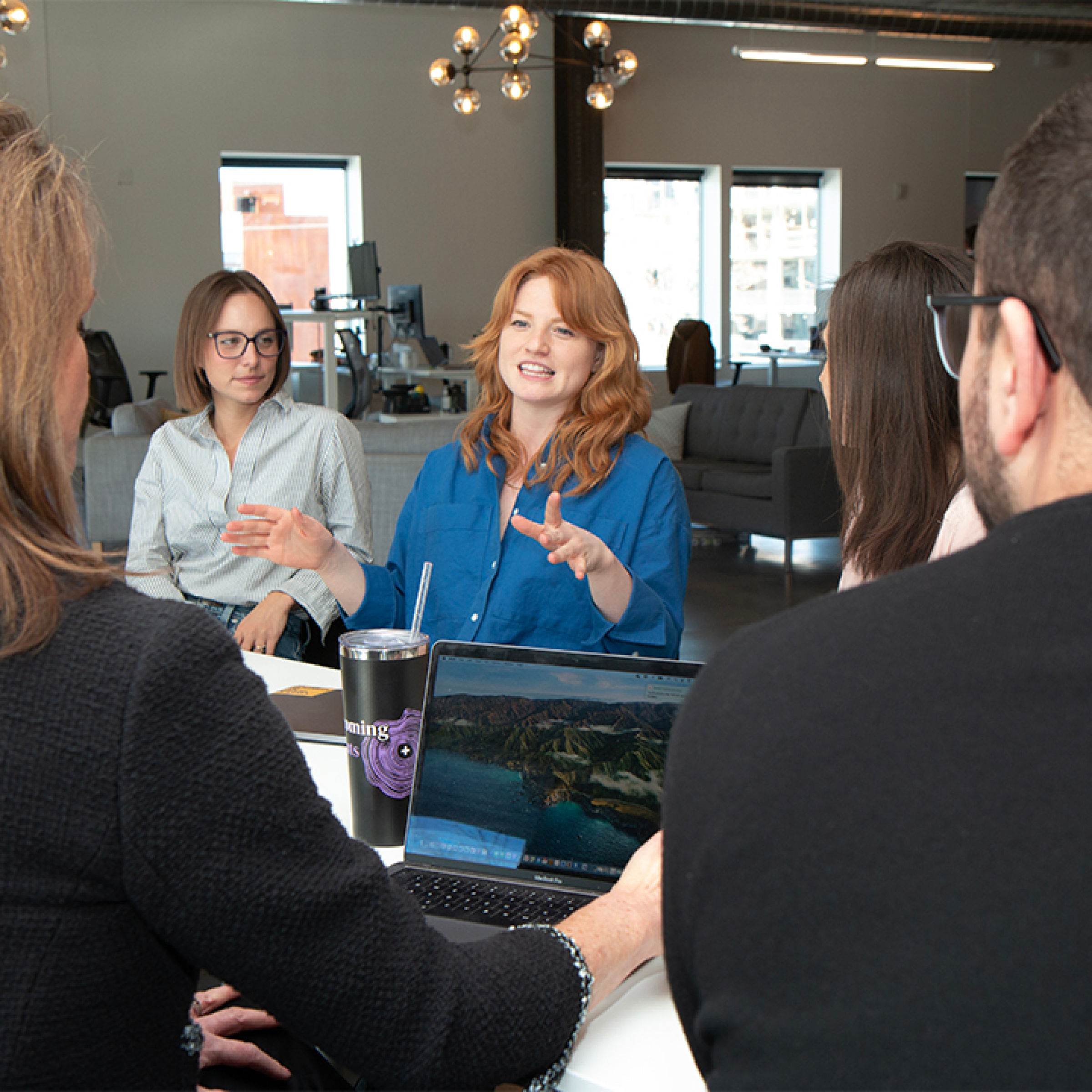 Transformative partnership group meeting in modern office Valtech